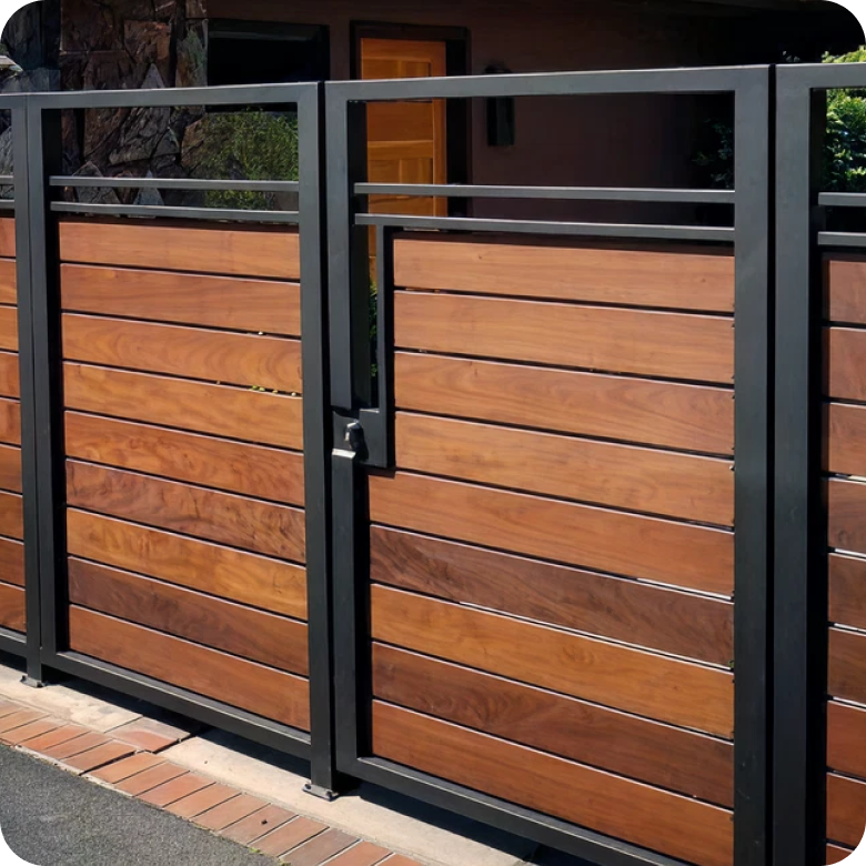A modern double gate featuring horizontal wood slats and a black metal frame.